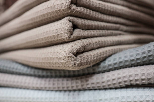 Close-up texture of natural linen fabric with soft folds